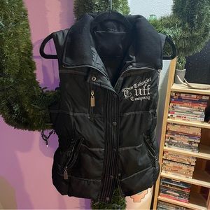 Cowgirl Tuff black vest “Never Give Up” on the back.